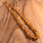Preview: Bernsteinkette kurz, kleine Perlen, mattiert-honighell, ca. 45 cm