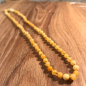 Preview: Bernsteinkette kurz, kleine Perlen, mattiert-hell, ca. 45 cm