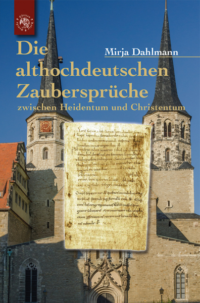 Das Buchcover mit einem handgeschriebenem Pergamenttext im Vordergrund.